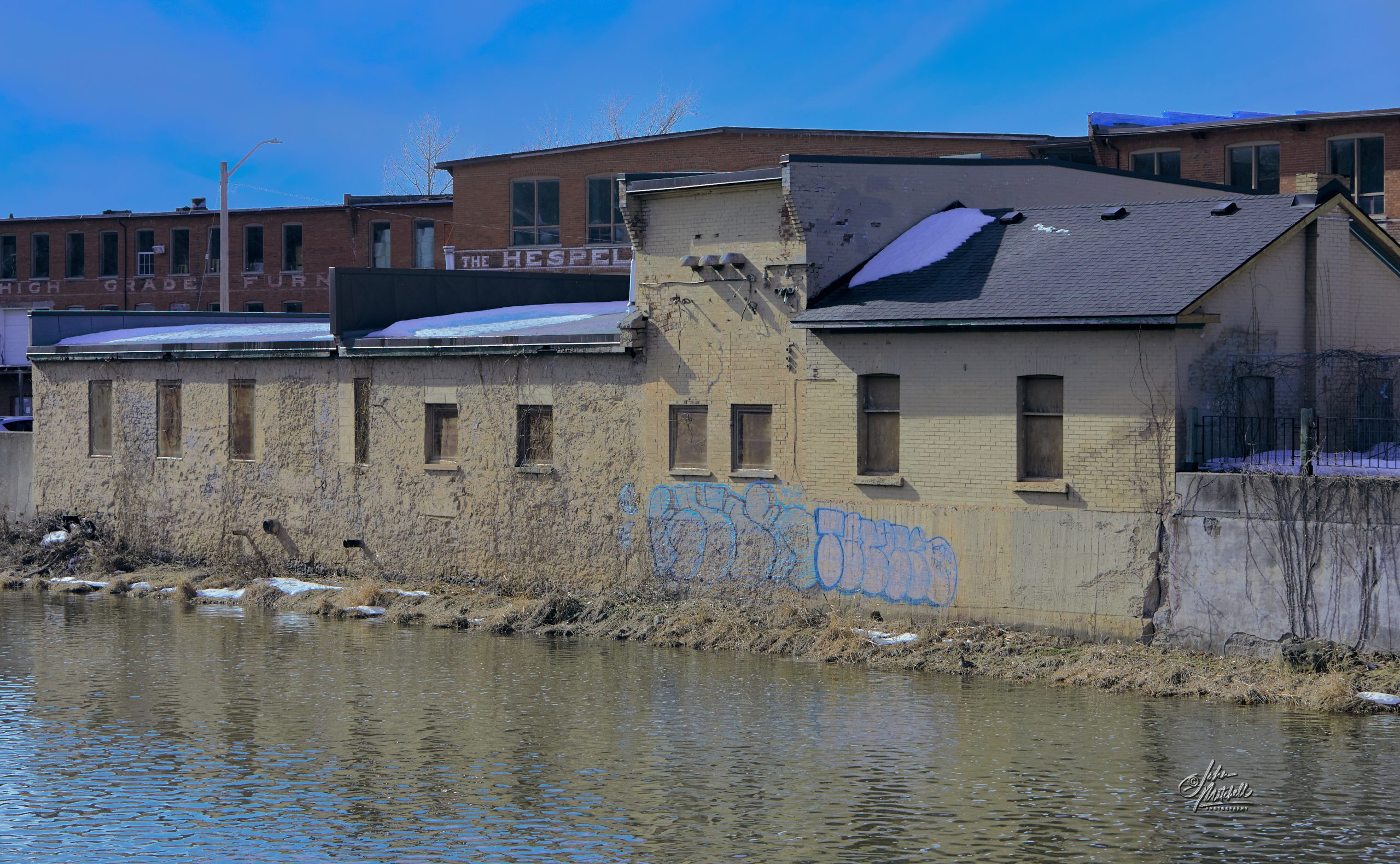 Photograph of building on the Speed River in the village of Hespeler.