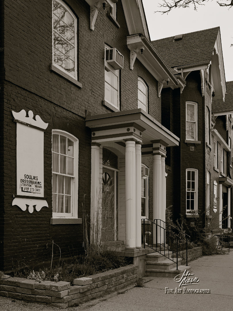 Sepia black and white photograph of houses that are now businesses on Albert Street in Stratford.