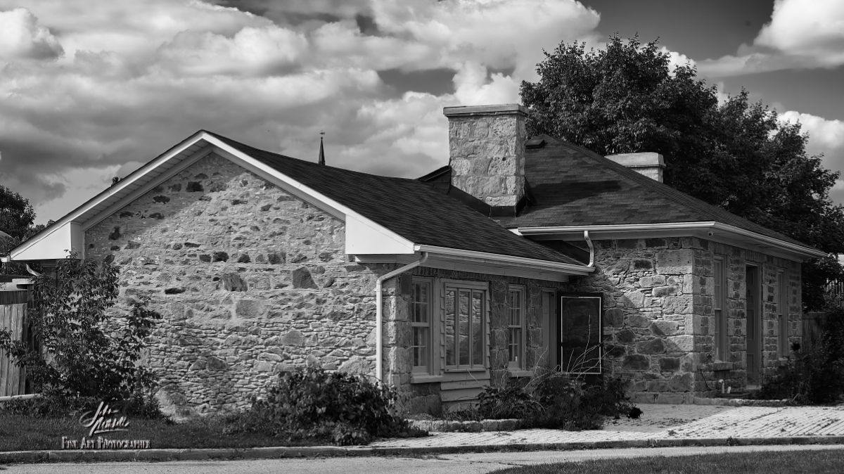 Black and white photograph of heritage building on Water Street South in Cambridge