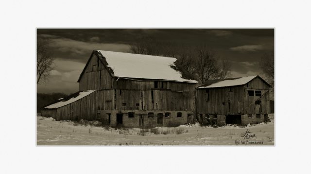 Seen better days. Black and white print of old barn in winter