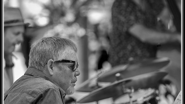 Black and white added a theatrical look to the image and eliminated the colour cast from the overhead canopy.